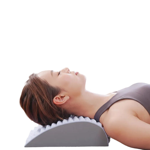 Person using a neck pillow for spinal decompression